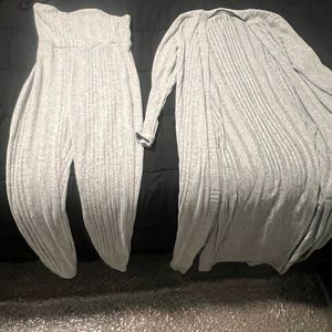 This is a one piece gray jumpsuit with a long sweater cardigan to match size xs